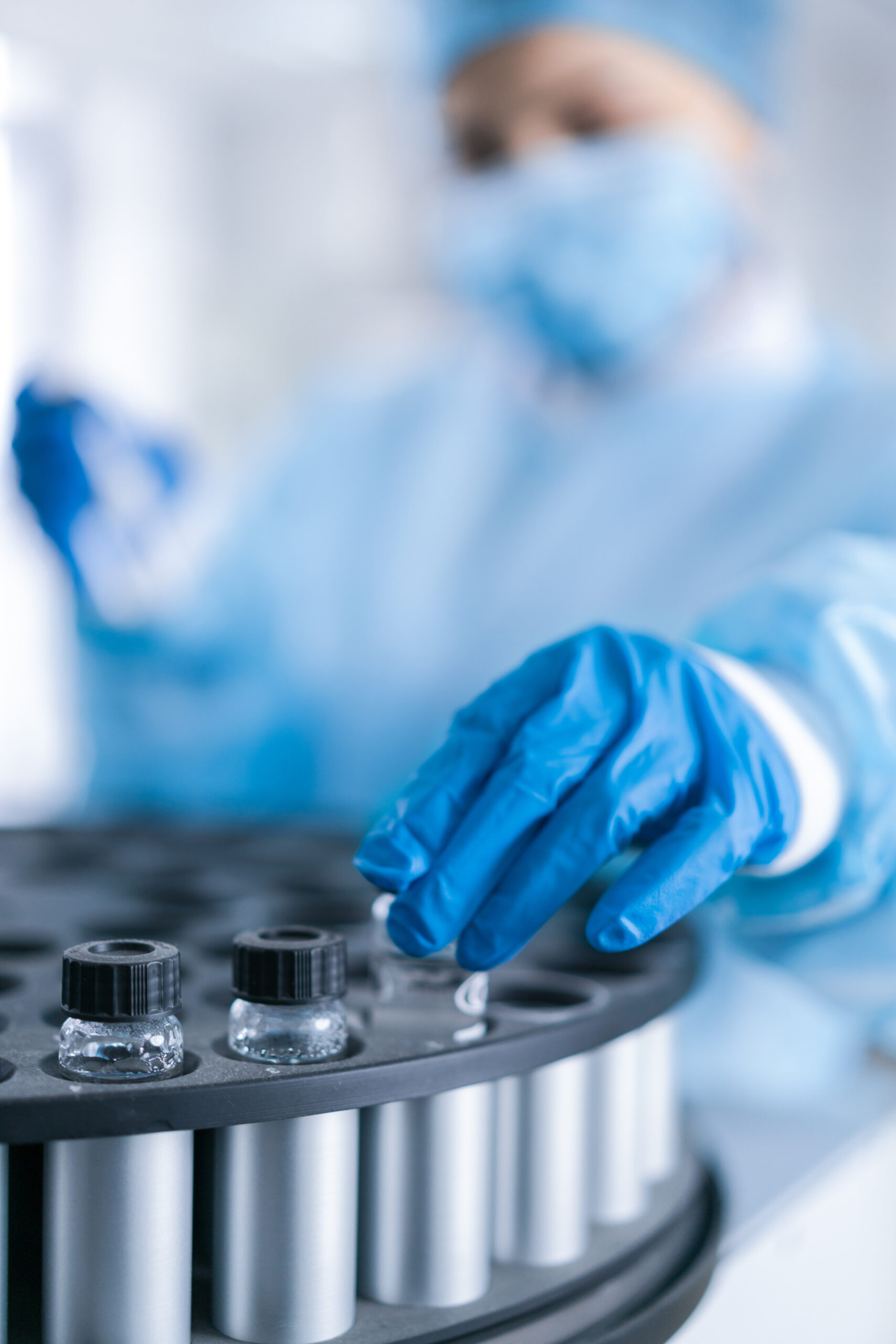 Female scientist analyzing sample in the CDC laboratory.